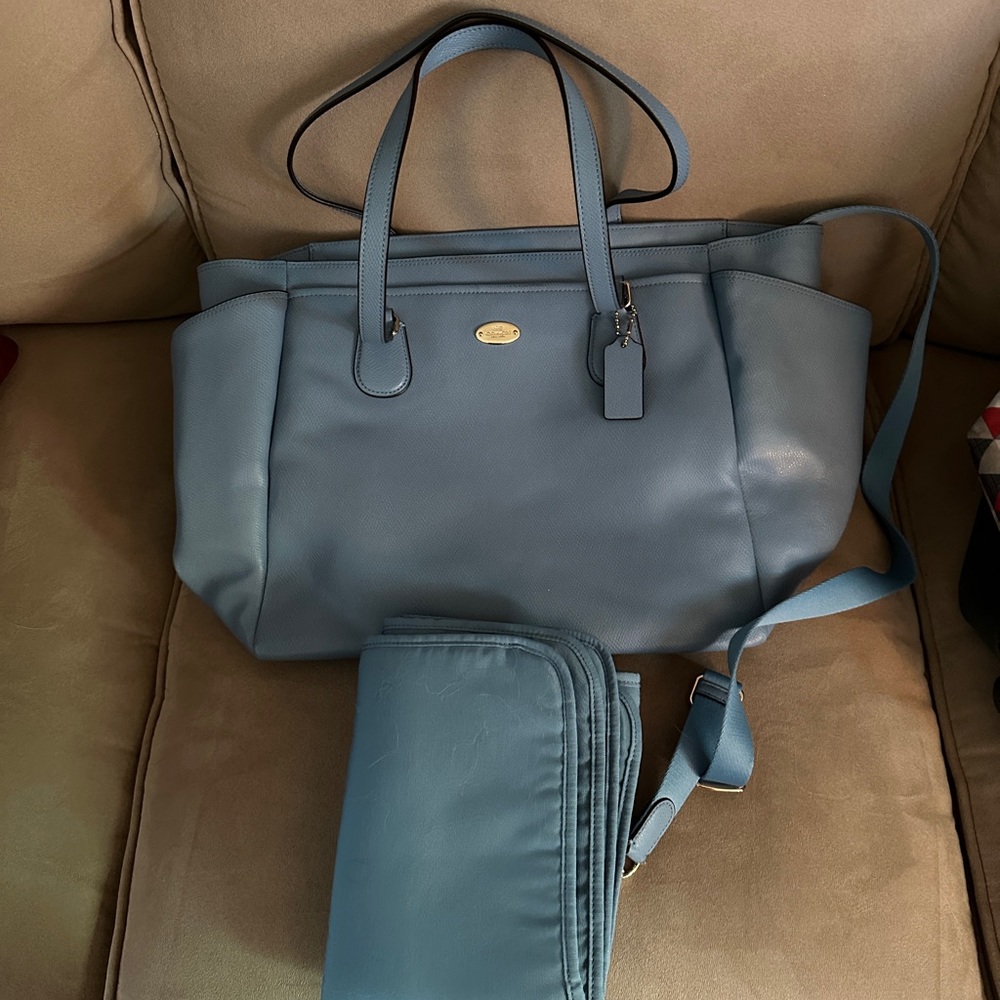 Coach leather diaper bag. Includes long strap and changing pad.